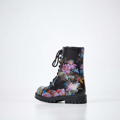 Side view of 511 Pink Roses unisex leather boots showcasing black floral pattern and sturdy sole.