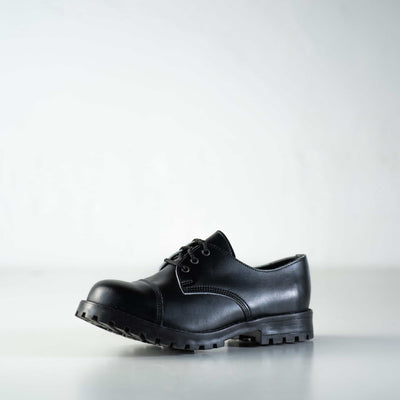 Black unisex genuine leather shoes with robust sole, designed to meet military-grade standards.
