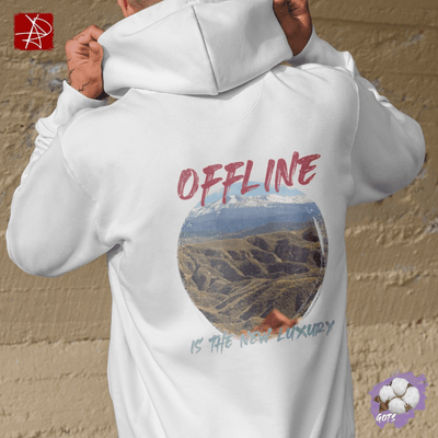 White organic cotton hoodie featuring mountain landscape and 'Offline Is The New Luxury' text, symbolizing nature and mindfulness.