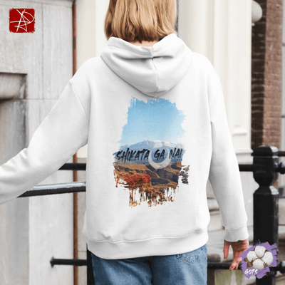 Back view of a person wearing a Shikata Ga Nai organic cotton hoodie with mountain design.