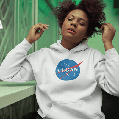 Woman wearing a Vegan Nasa Organic Cotton Hoodie, showcasing eco-friendly style and comfort.